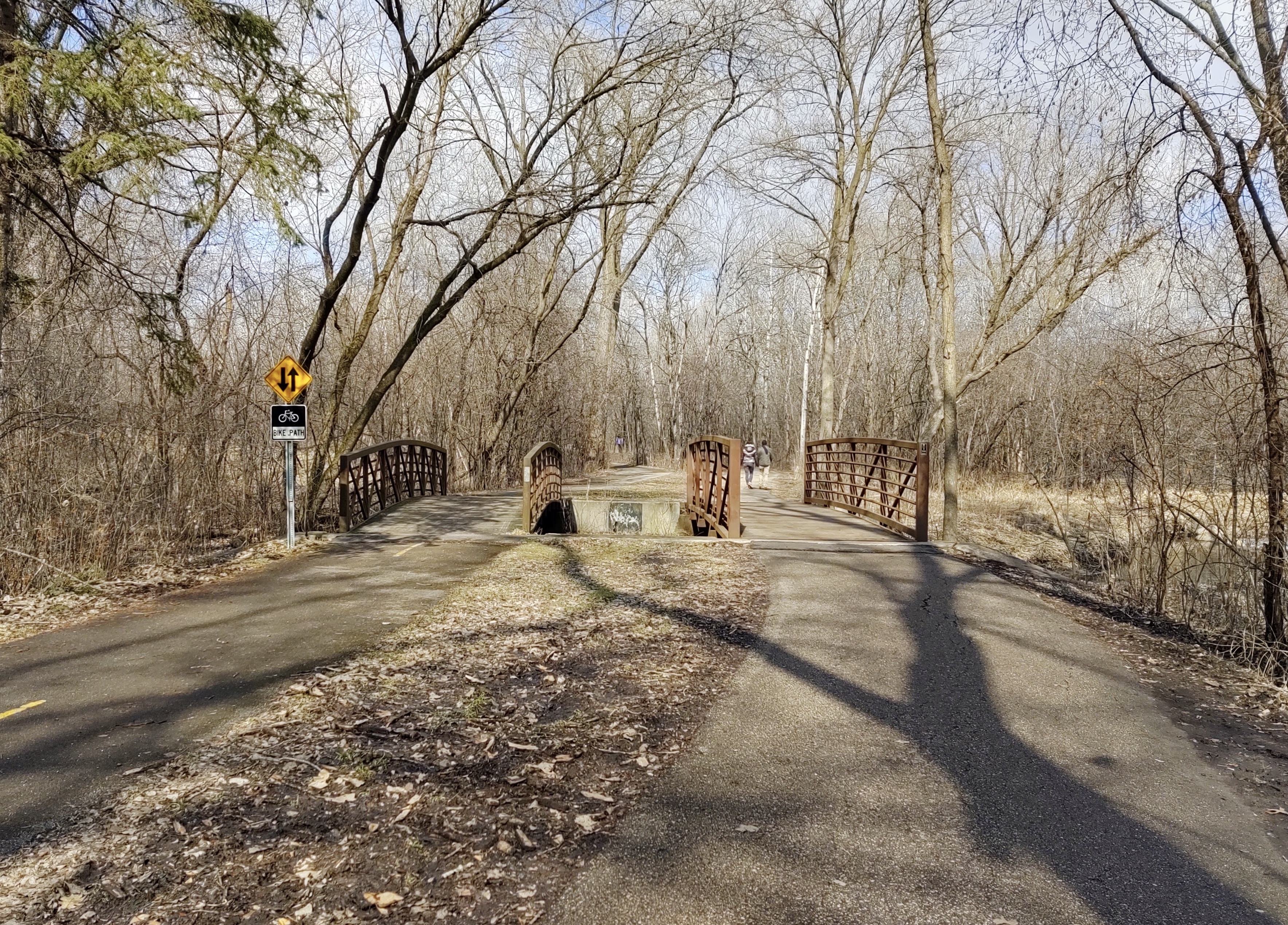 Two bridges on wooded trails in Bredesen Park.