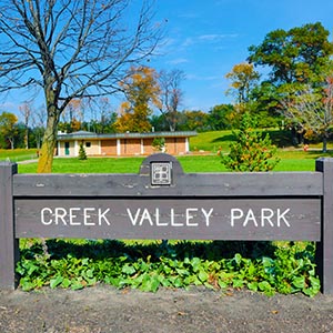Creek Valley Park entrance sign.